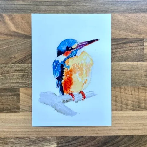 Watercolour painting of a kingfisher sat on a branch