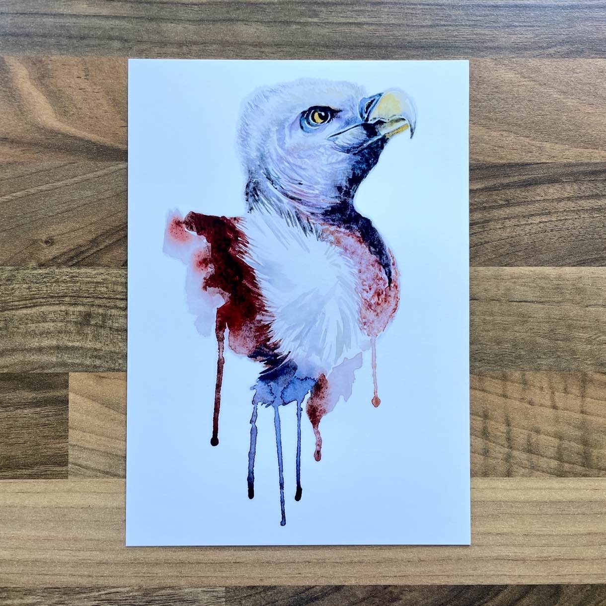 Watercolour painting of an American eagle's head with paint drip effect