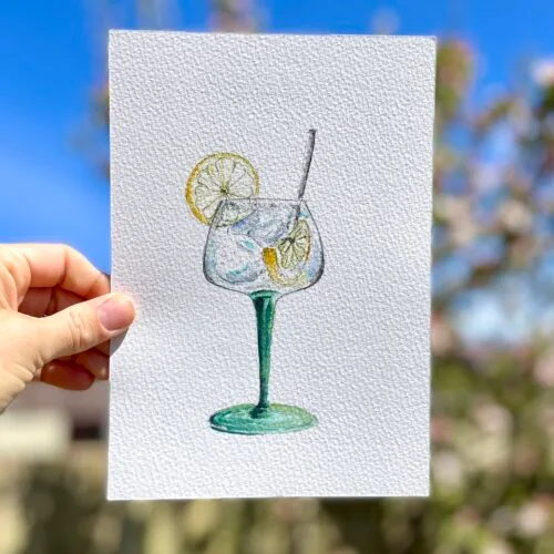 Original watercolour painting of gin and tonic in a large balloon style glass with ice and a slice