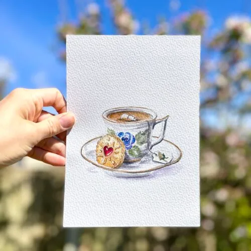 Original watercolour painting of a vintage teacup and jam filled biscuit