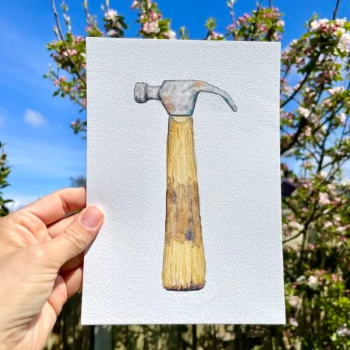 Original watercolour painting of a well loved hammer with wooden handle