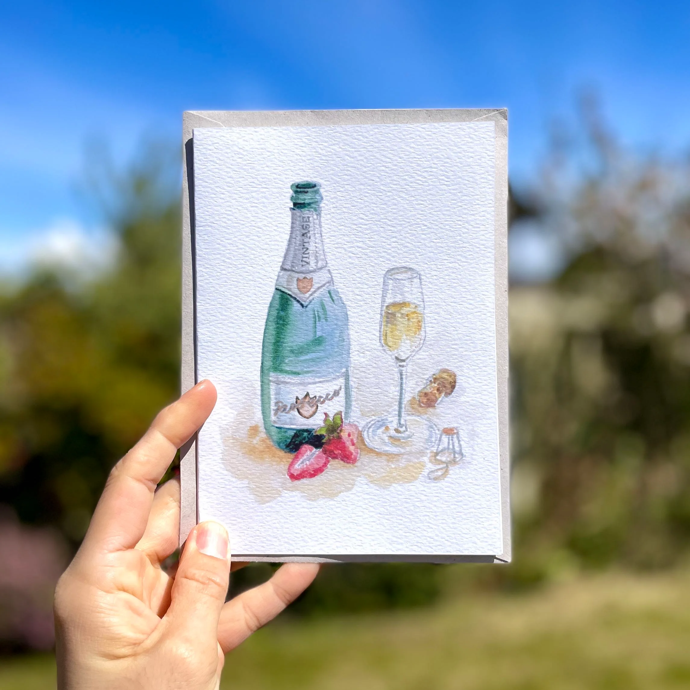 Watercolour prosecco on an A5 greetings card