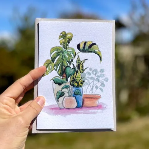Watercolour monstera plant on an A5 greetings card