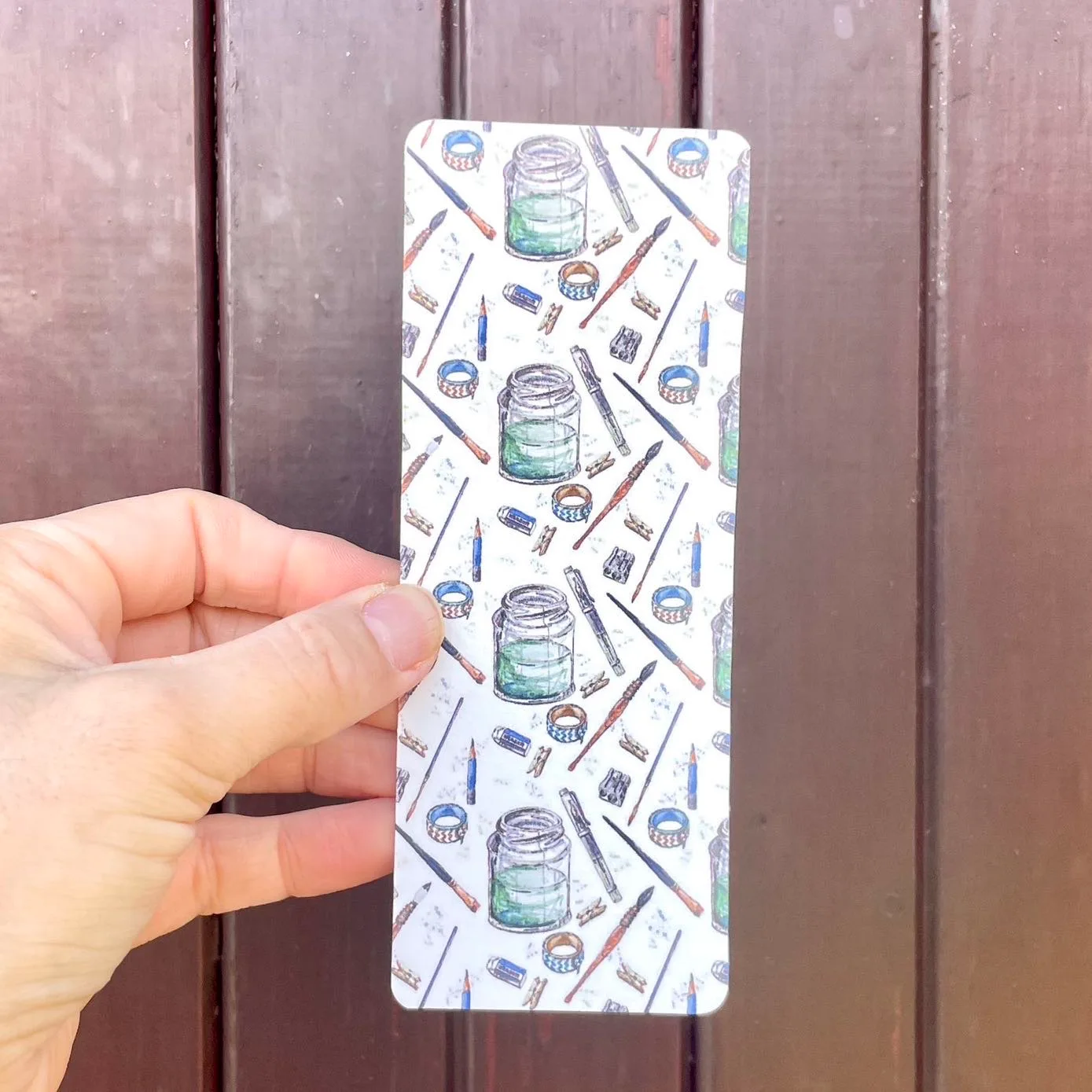 Bookmark made from 300gsm watercolour paper decorated with art supplies watercolour illustrations