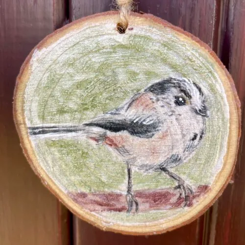 Watercolour long tailed tit on a small wooden slice with twine to hang it up with