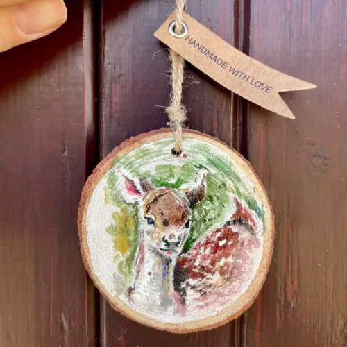 Watercolour deer on a small wooden slice with twine to it up with