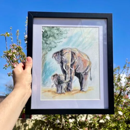 original watercolour painting of a mother and baby elephant sold in a black frame with a white mount