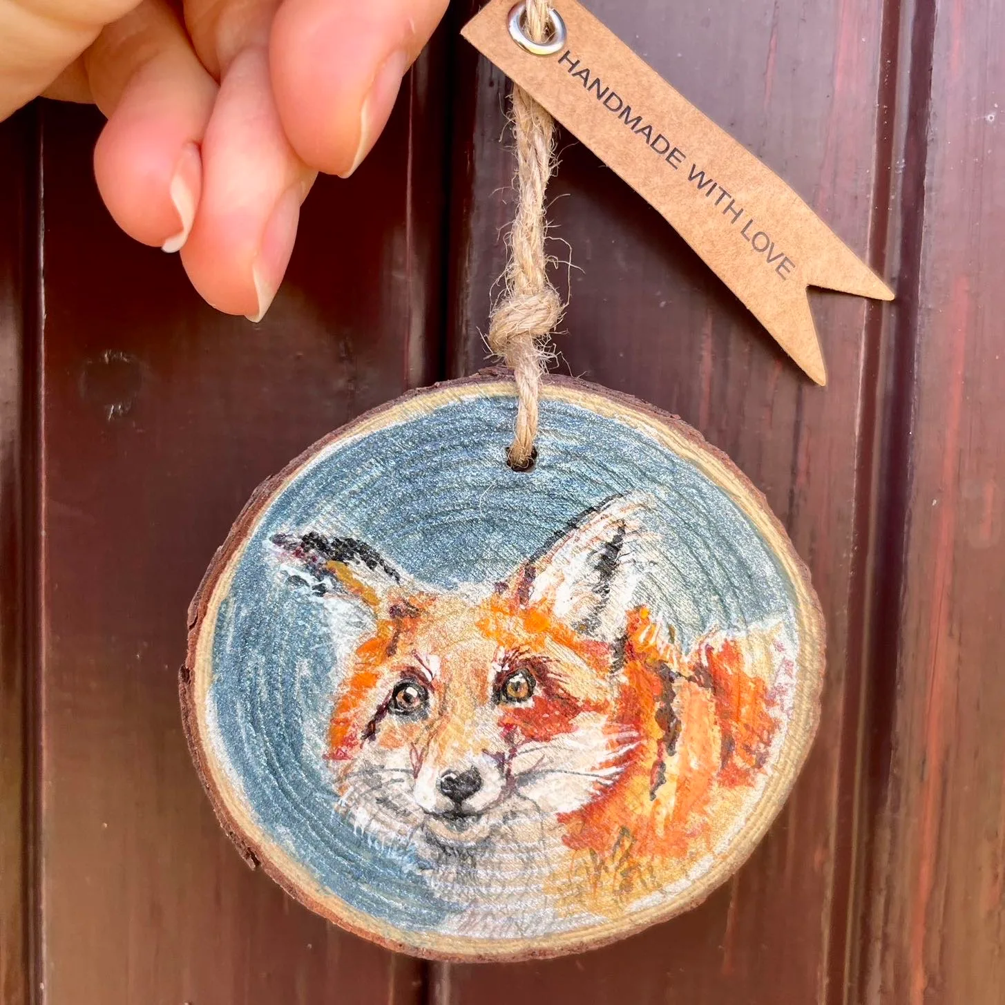 Watercolour fox on a small wooden slice with twine to hang it up with