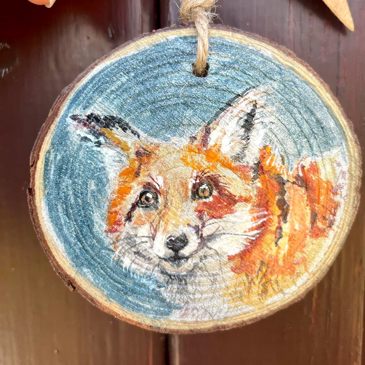 Watercolour fox on a small wooden slice with twine to hang it up with